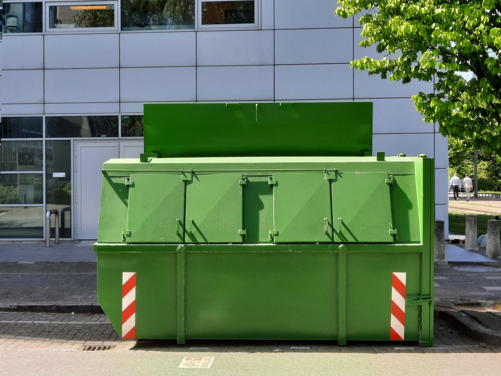 Roll-off dumpster in a lot, not a photo of this company